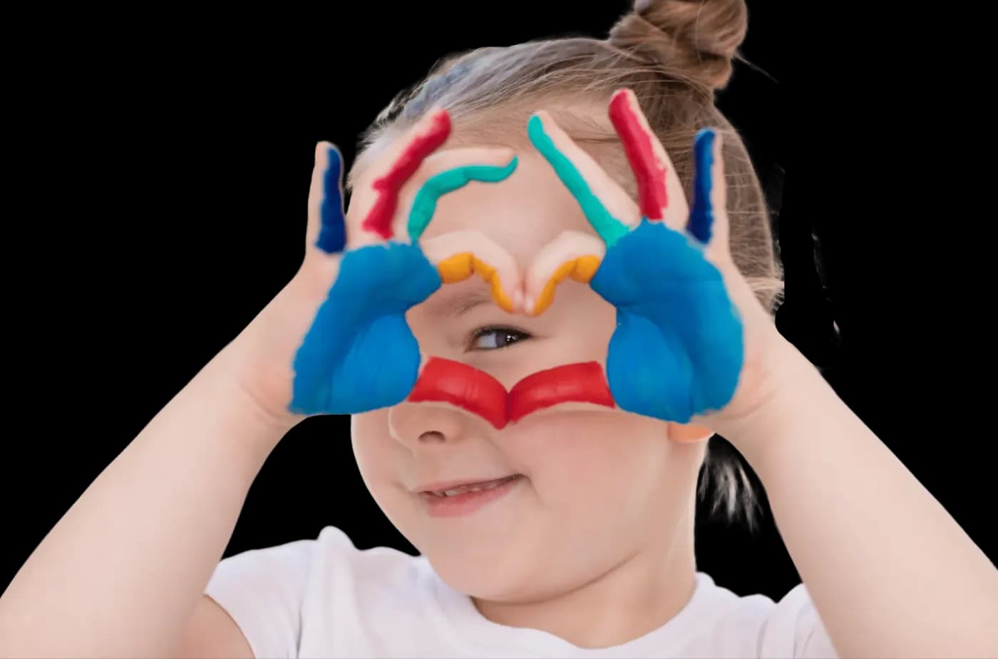 Adult and child hands together forming a heart shape
