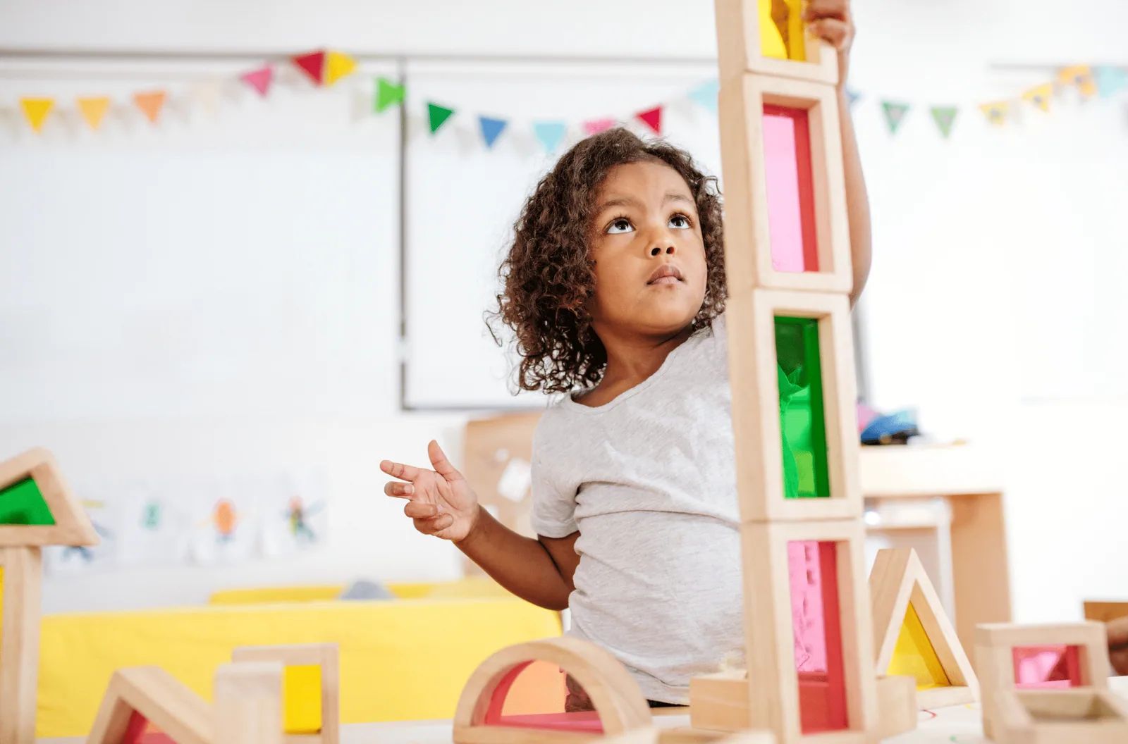 A caregiver and therapist working together with a child during a home session