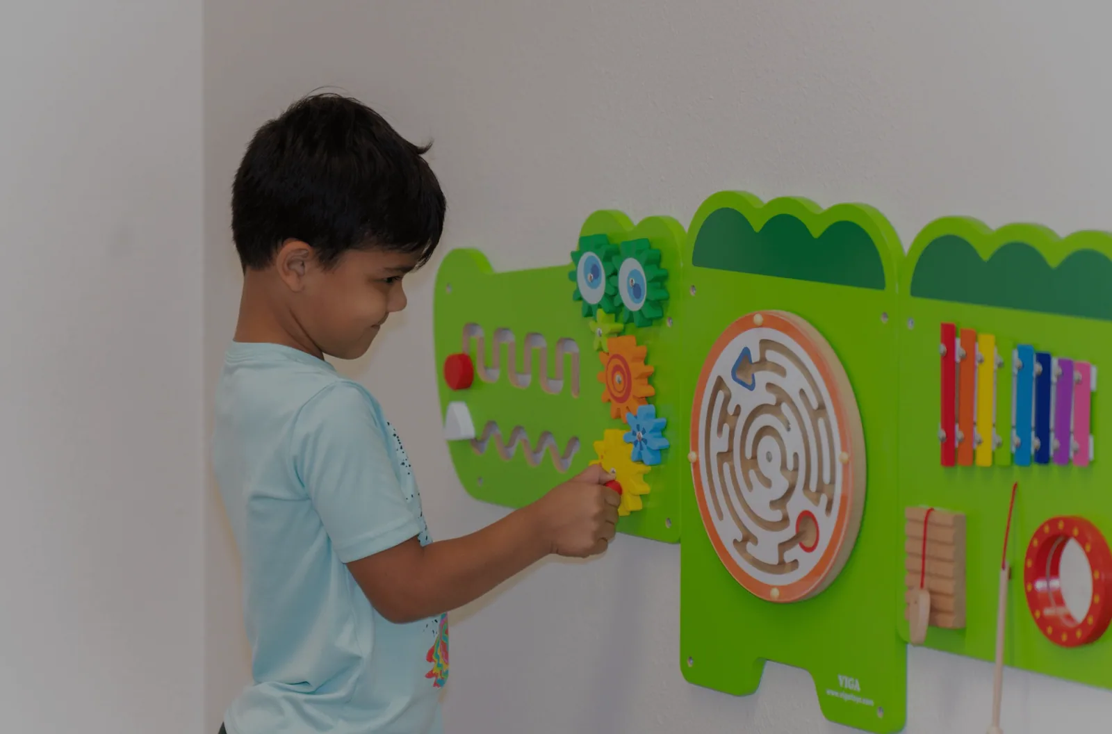 A child and an ABA therapist working together one-to-one at a table